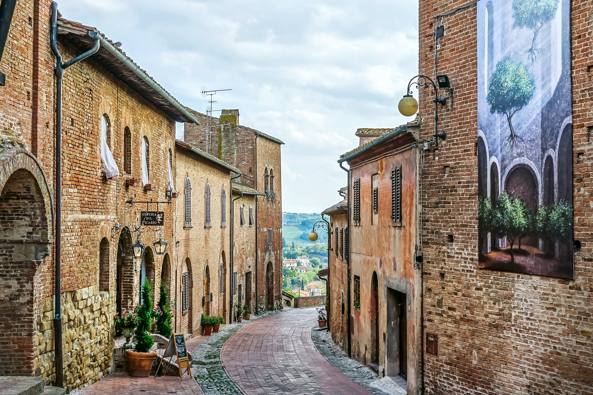 Certaldo street with view of Tuscan countryside